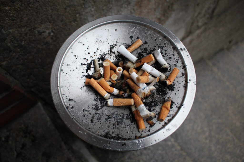 An ashtray full of cigarettes. Photo by Julia Engel on Unsplash