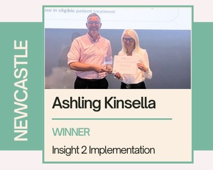 AShling Kinsella receives an award for the Pharmacy teams project. Text down the side reads 'Newcastle' and text below reads "Ashling Kinsella, Winner, Insight 2 Implementation"