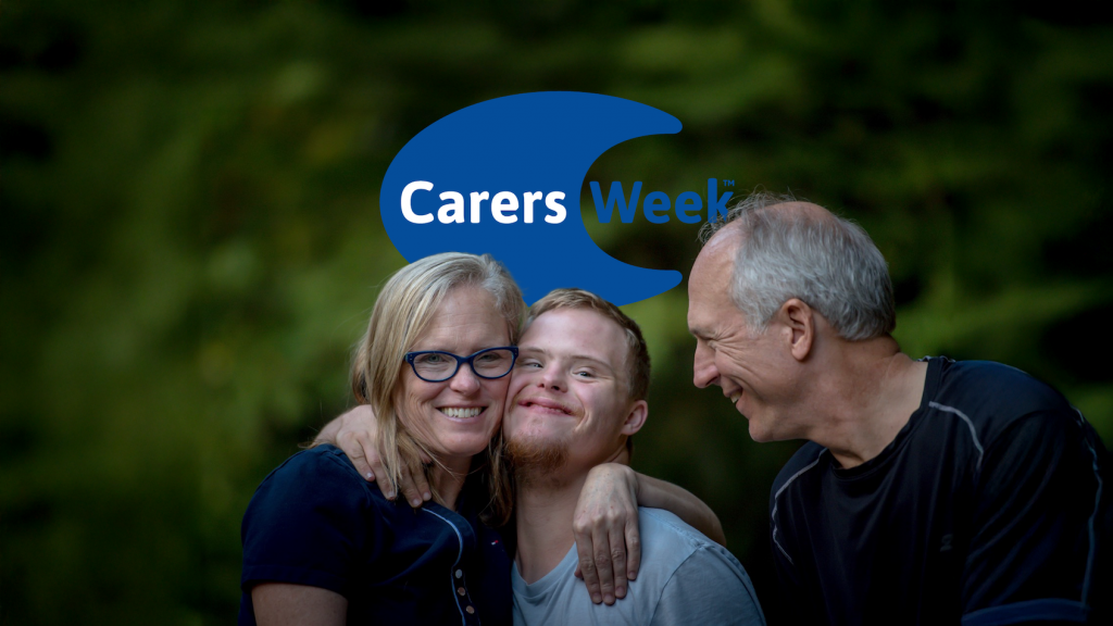 A woman and two men hug and smile. Blue and white background image reads Carers WeekPhoto by Nathan Anderson on Unsplash