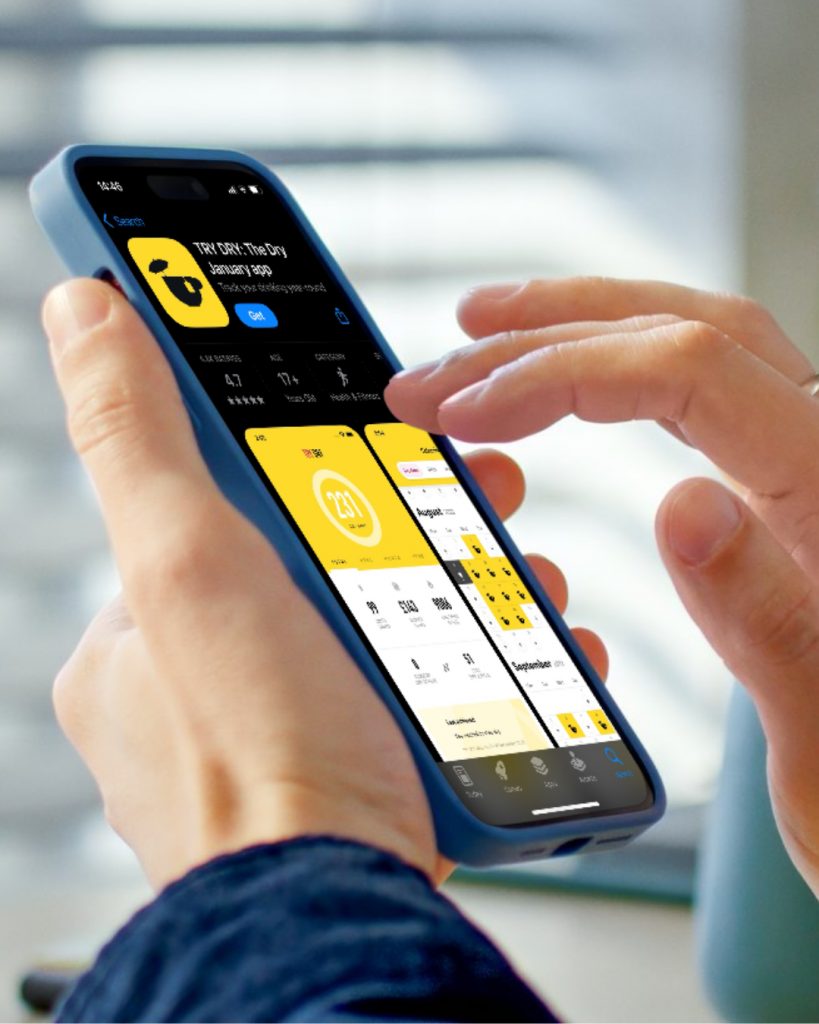 A smartphone held by a awhite person shows the Try Dry app being downloaded.