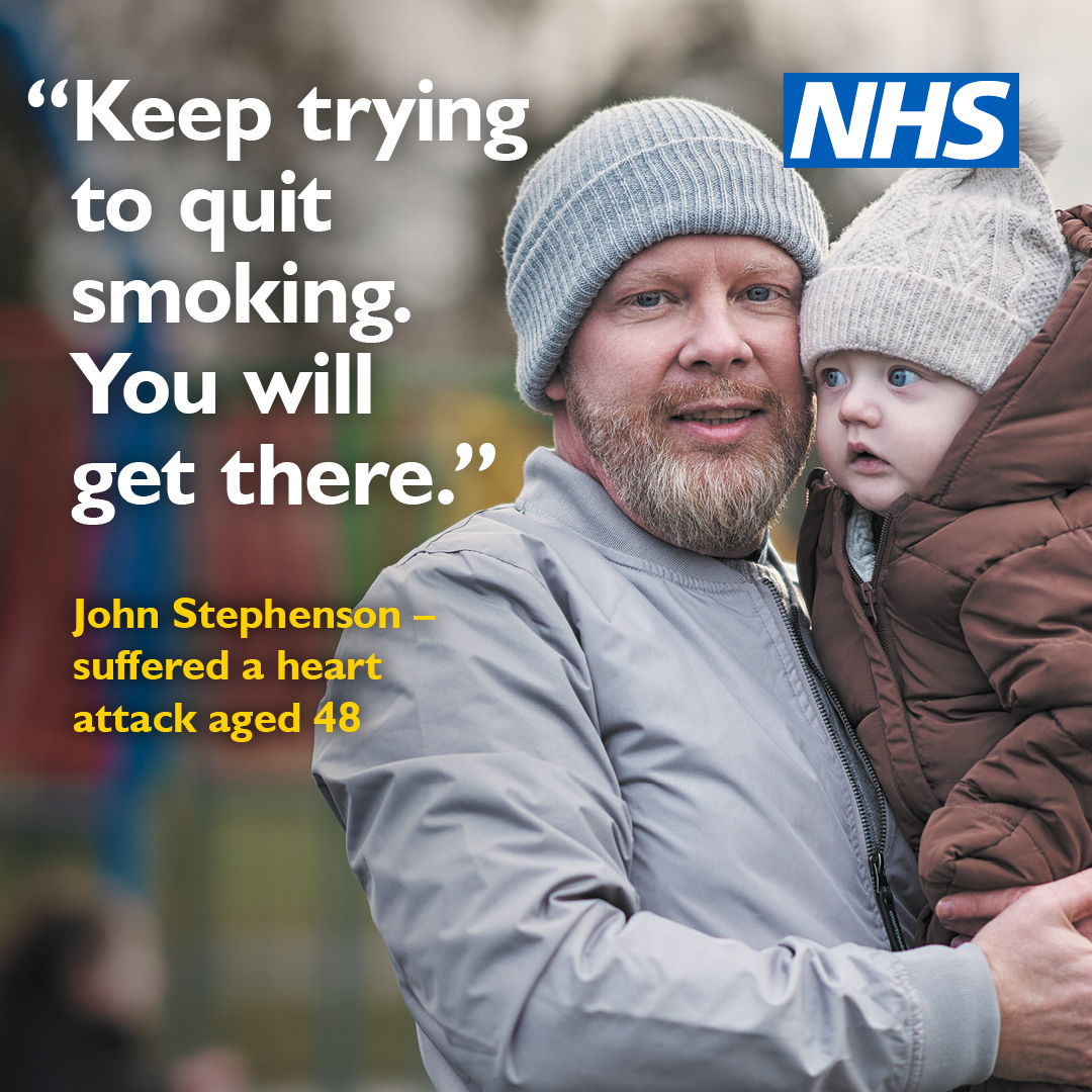 Man wearing a hat holds a young child outdoors. Text reads: “Keep trying to quit smoking. You will get there.” Caption notes he suffered a heart attack aged 48. NHS logo shown.